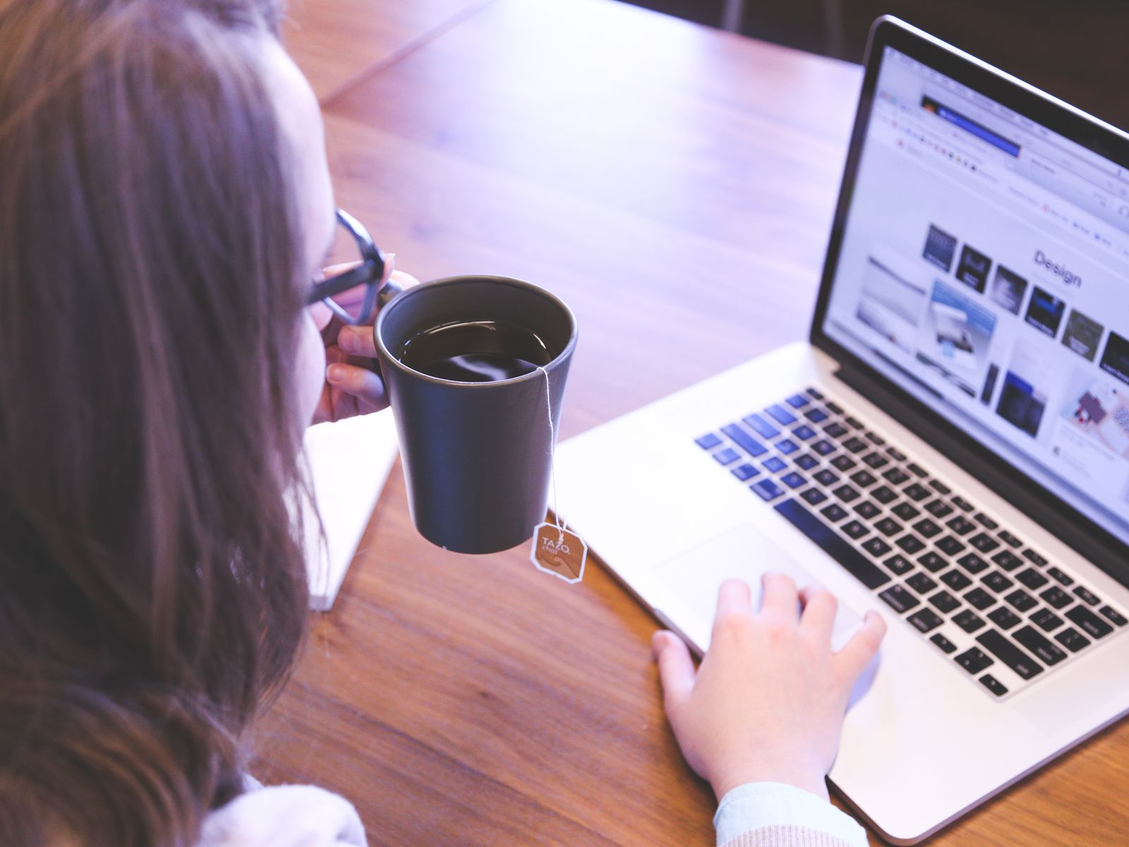 Working on a laptop with coffee